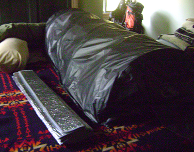 lie down sauna on bed, reflecting matt on left